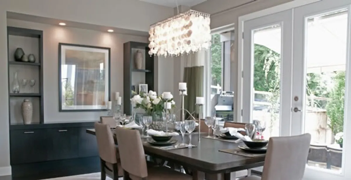 Elegant dining room chandelier installation above table in Pasadena, CA