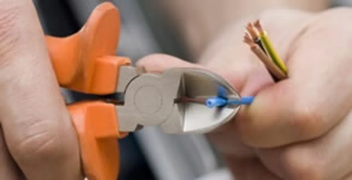 professional electrical services showing precise wire cutting by licensed electricians in Pasadena, CA